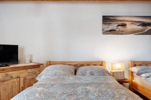 Postel nebo postele na pokoji v ubytování Villa Grenzenlos