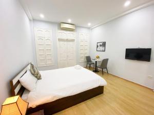 Postel nebo postele na pokoji v ubytování Eco Nest Hotel Đình Ngang