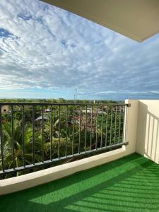 a balcony with a view of the ocean at Saekyung Condo in Lapu Lapu City