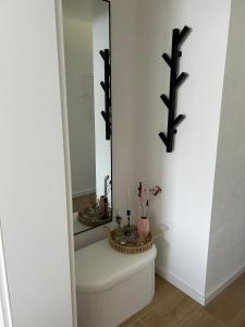 a bathroom with a sink and a mirror at RheinSchatz Apartments 6 in Oberwesel