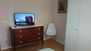 TV a/nebo společenská místnost v ubytování as maison