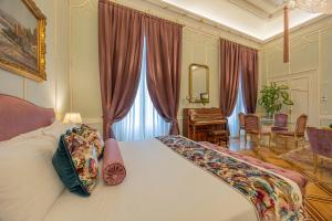 Posteľ alebo postele v izbe v ubytovaní Palazzo Monga Boutique Guesthouse