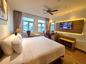 Postel nebo postele na pokoji v ubytování Tulip Hotel 2