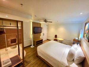 Postel nebo postele na pokoji v ubytování Tulip Hotel 2