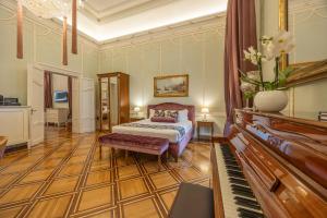 Posteľ alebo postele v izbe v ubytovaní Palazzo Monga Boutique Guesthouse