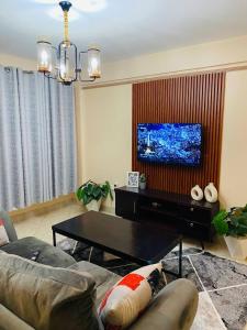 TV a/nebo společenská místnost v ubytování M&J Homes