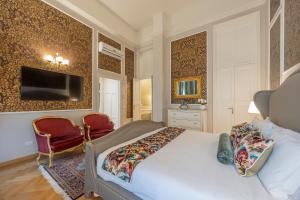 Televízia a/alebo spoločenská miestnosť v ubytovaní Palazzo Monga Boutique Guesthouse