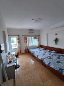 Postel nebo postele na pokoji v ubytování Nhím biển