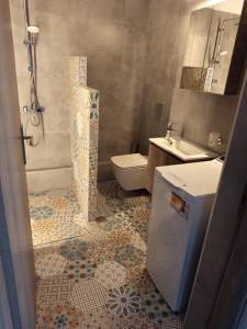 Koupelna v ubytování SPΛCES PYLOS Apartments + 37 fotografií