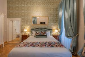 Posteľ alebo postele v izbe v ubytovaní Palazzo Monga Boutique Guesthouse
