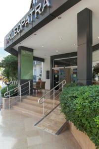 a lobby of a building with stairs and a sign at Kleopatra Tuna Apart Hotel in Alanya