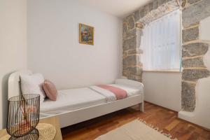 Postel nebo postele na pokoji v ubytování Apartment Marina Kornić + 37 fotografií