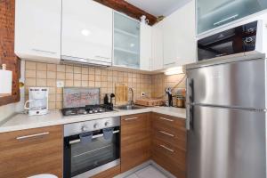 Kuchyň nebo kuchyňský kout v ubytování Apartment Marina Kornić