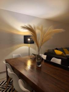 a dining room with a table and a bed at Maison familiale en bord de mer avec JACUZZI in Vaux-sur-Mer