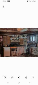 a view of a kitchen with a stove and cabinets at A Casa da Natália in Alvares +18 photos