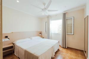 Ένα ή περισσότερα κρεβάτια σε δωμάτιο στο Apartamentos Blancala