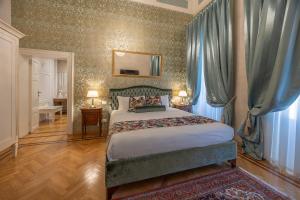 Posteľ alebo postele v izbe v ubytovaní Palazzo Monga Boutique Guesthouse