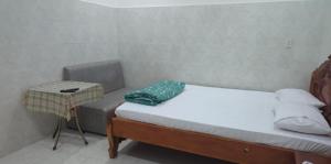 Postel nebo postele na pokoji v ubytování Nhà Nghỉ Mỹ Linh