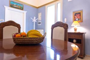a basket of fruit on a table in a room at Old House - Historic Beauty Central Home, Otranto in Otranto +5 photos