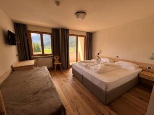 Postel nebo postele na pokoji v ubytování Hotel Savoia