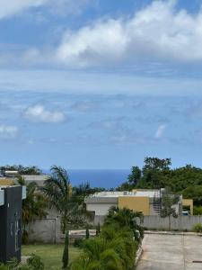 a view of the ocean from a building at Villa Christine in Ocho Rios