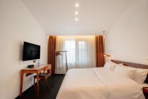TV a/nebo společenská místnost v ubytování Xingle Hotel-Suzhou Guanqian Street Pingjiang Road