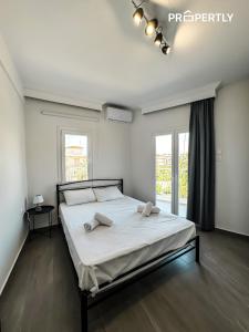 Postel nebo postele na pokoji v ubytování G&G Seaside Apartment
