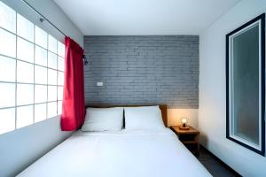 Postel nebo postele na pokoji v ubytování GO INN Sukhumvit Soi 20 - โกอิน สุขุมวิท 20 BTS อโศก