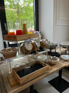 a table with glasses and other items on it at Livia Valeria Palace in Rome
