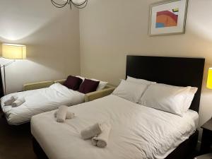 Postel nebo postele na pokoji v ubytování Green Ariana Hotel - near Wembley and central London