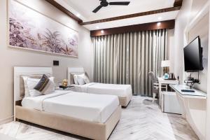 Gulta vai gultas numurā naktsmītnē Skon Boutique by Orion Hotels