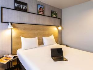 Postel nebo postele na pokoji v ubytování ibis Epinal Centre