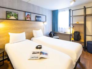 Postel nebo postele na pokoji v ubytování ibis Epinal Centre + 37 fotografií