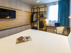 Postel nebo postele na pokoji v ubytování ibis Epinal Centre