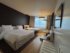 Voodi või voodid majutusasutuse Pullman Brussels Centre Midi toas