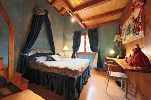 a bedroom with a bed and a desk in a room at Chalet avec charme et vue à Crans-Montana in Crans-Montana