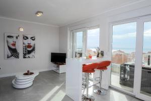 TV a/nebo společenská místnost v ubytování Apartments Tomana