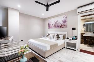 Gulta vai gultas numurā naktsmītnē Skon Boutique by Orion Hotels
