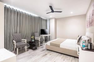 Gulta vai gultas numurā naktsmītnē Skon Boutique by Orion Hotels