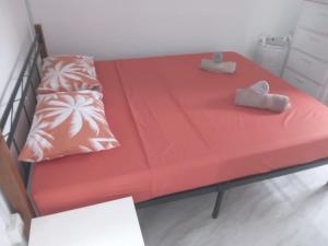 Postel nebo postele na pokoji v ubytování Ô Bercail du Sud-Hibiscus chez Jeannette