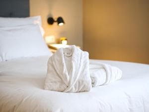 Cama o camas de una habitación en Hotel Ciudad del Sol
