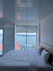 En eller flere senge i et værelse på Pantai Concesso Resort Haranggaol