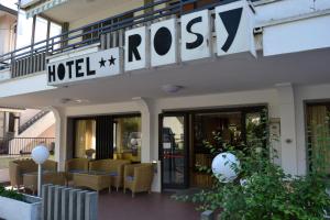 a hotel lobby with chairs and a sign on a building at Hotel Rosy in Bellaria-Igea Marina +68 photos