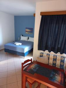 A bed or beds in a room at Mari Helen