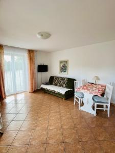 a living room with a couch and a table at Agroturystyka in Kościerzyna +6 photos