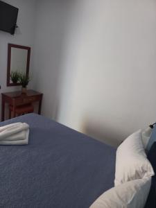 A bed or beds in a room at Mari Helen