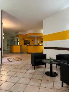 A kitchen or kitchenette at BE ME Hotel Helvetia