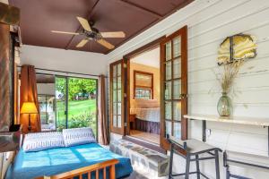 a living room with a bed and a window at Pecan Creek Cottage in Fourth Crossing