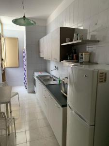 Kuchyň nebo kuchyňský kout v ubytování Villetta Clara al mare nel Salento + 8 fotografií