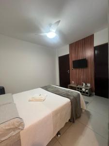 Postel nebo postele na pokoji v ubytování Apartamento Impecável